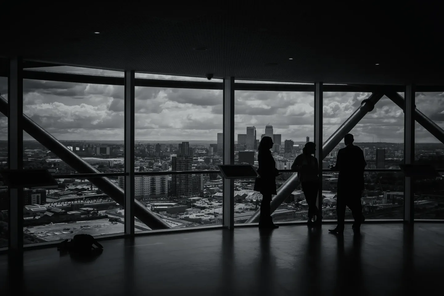 Black-and-white view over a city from an observation deck — the primary market seen from above